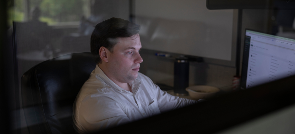 An investment banker working late at his desk