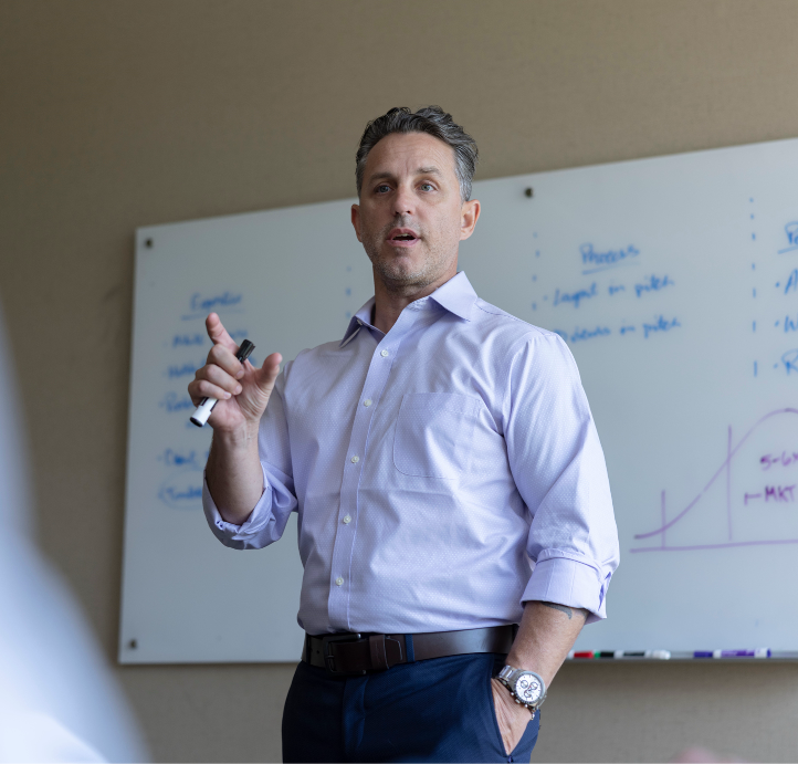 An investment banker giving a pitch to a founder